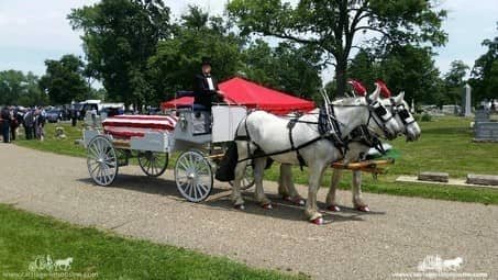 Caisson Hearse with flag-draped casket at a service in Coshocton, OH