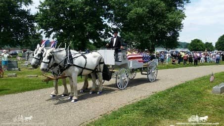 Caisson Hearse draped in funeral regalia at a service in Coshocton, OH