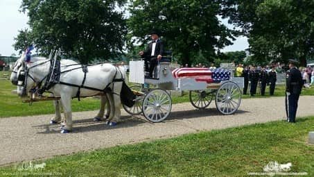 Caisson Hearse approaching the cemetery at a funeral in Coshocton, OH