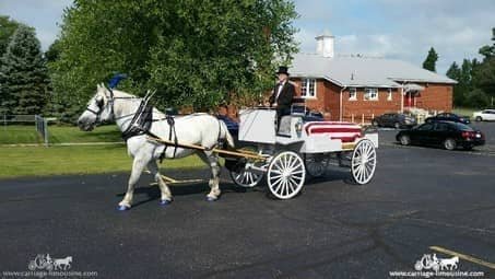 Caisson Hearse in a solemn funeral procession in Alliance, OH