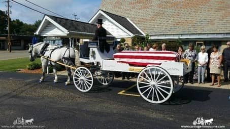 Horse-drawn Caisson Hearse during a funeral procession in Alliance, OH