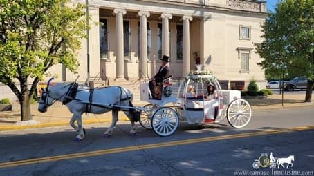 The bride taking a ride with a friend after the ceremony in Steubenville, OH