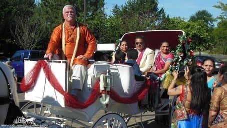 Groom and family making their way to the wedding in the Indian Wedding Carriage in Brunswick, OH
