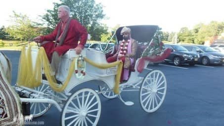 Groom standing in the Indian Baraat Carriage at La Centre in Westlake, OH