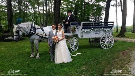 Bride and groom posing with the Limousine Carriage at Seven Springs Resort, PA